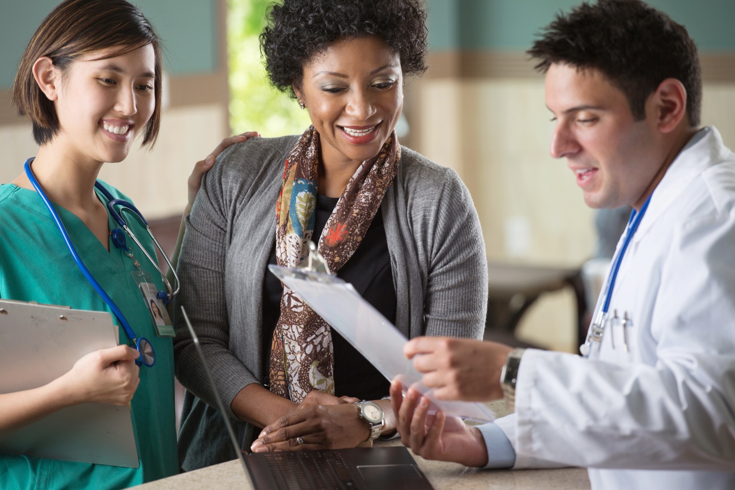 A practice care team reviewing a patient's plan together